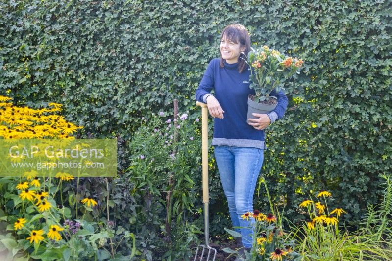 Woman talking whilst gardening