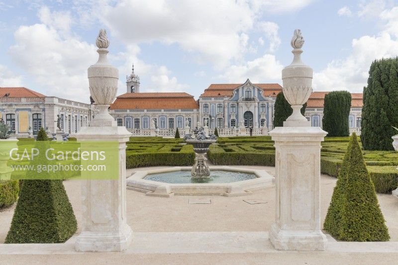 View through entrance to formal pond, parterre with palace beyond. Queluz, Lisbon, Portugal, September. 