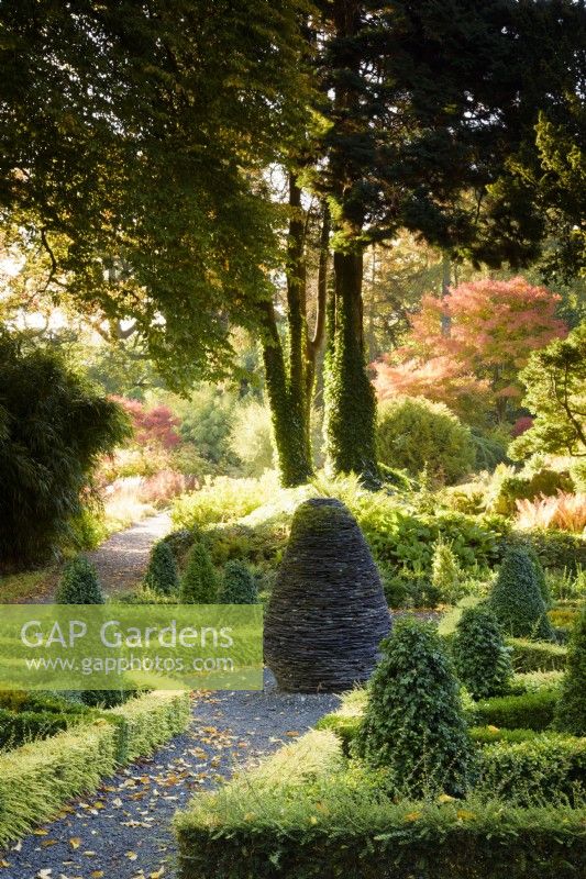 The Slate Garden, a knot garden in box and Lonicera nitida with a central slate sculpture, at Hergest Croft Gardens, Herefordshire in October