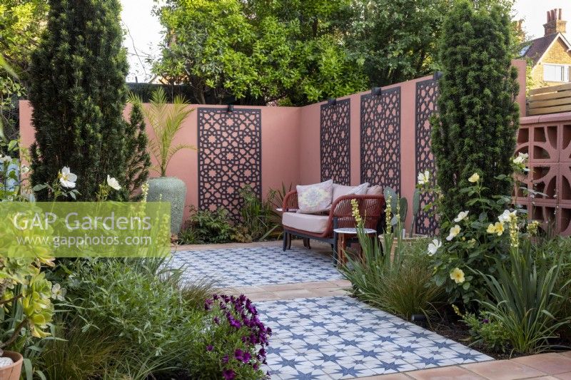 Moroccan style patio garden with decorative screens on wall