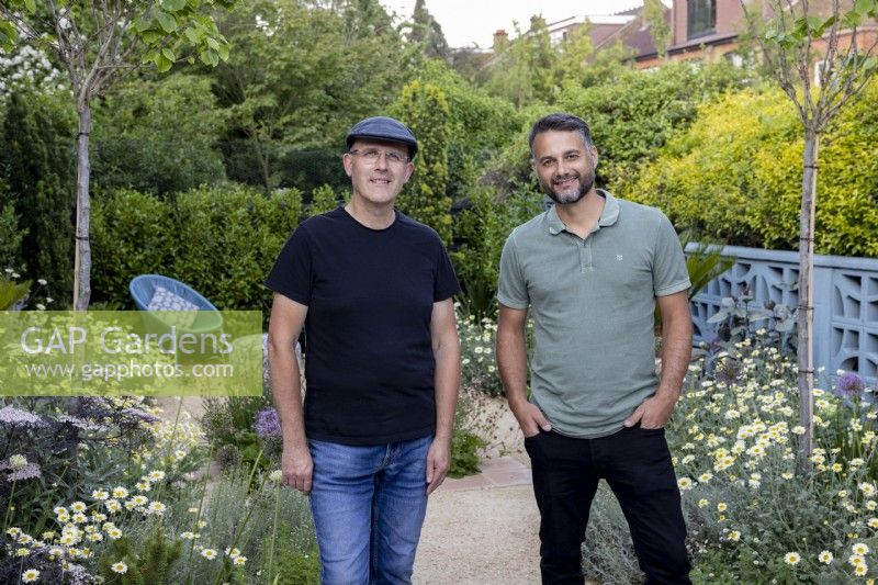 Designers Nick Gough and Douglas Vieira standing in a contemporary garden they have designed