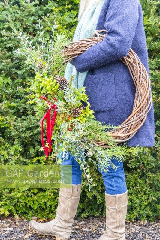 Woman carrying wreath