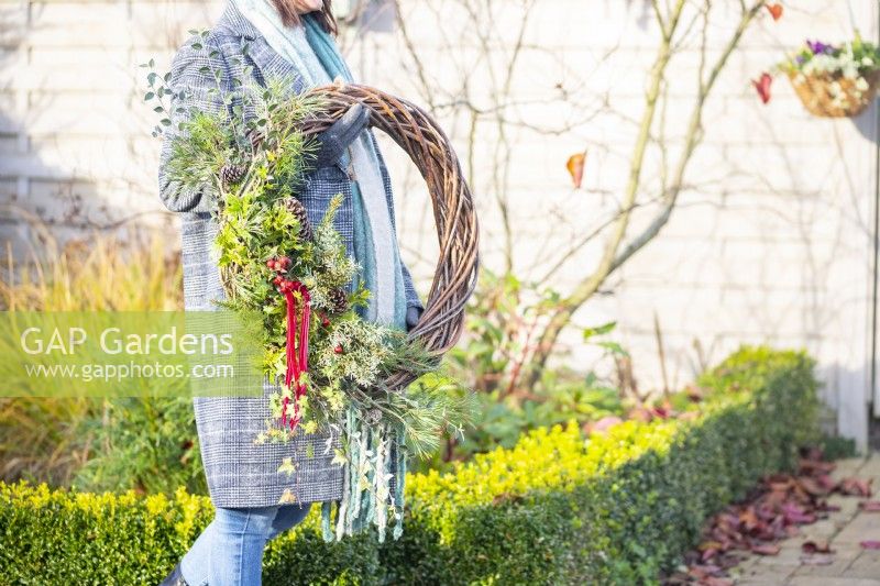 Woman carrying wreath
