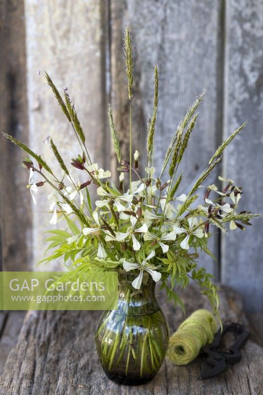 Spring posy with Rocket flowers, Sorbaria foliage and wild grass flowers.