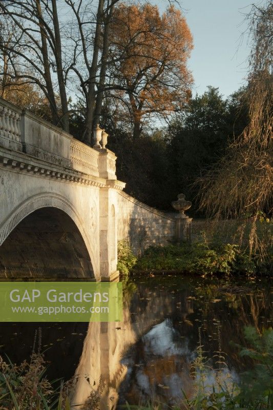 The Classic Bridge designed by James Wyat reflected in the lake at Chiswick House and Garden.