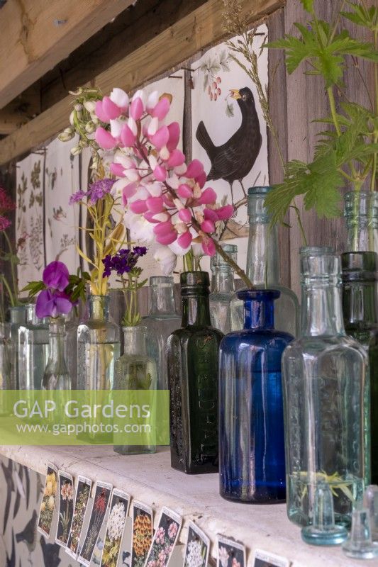 Victorian glass bottles used as display vases