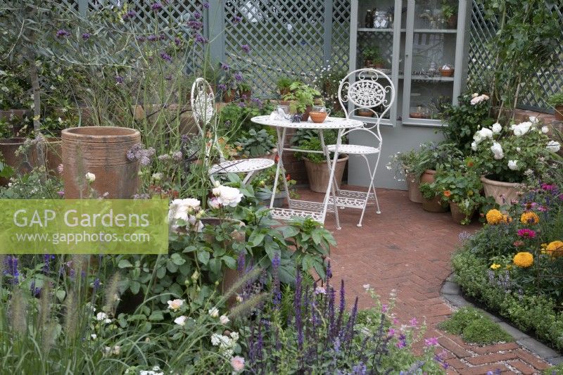 ''Nature's Resilience' at BBC Gardener's World Live 2021 - seating area amongst pastel themed perennials