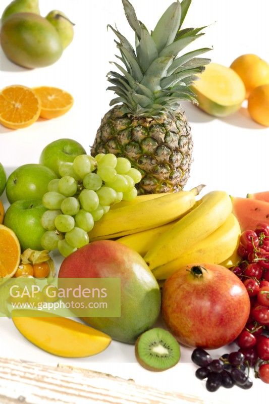Fruit mix with cherries, grapes, pineapple, mango, bananas, apples, punica, kiwi and more