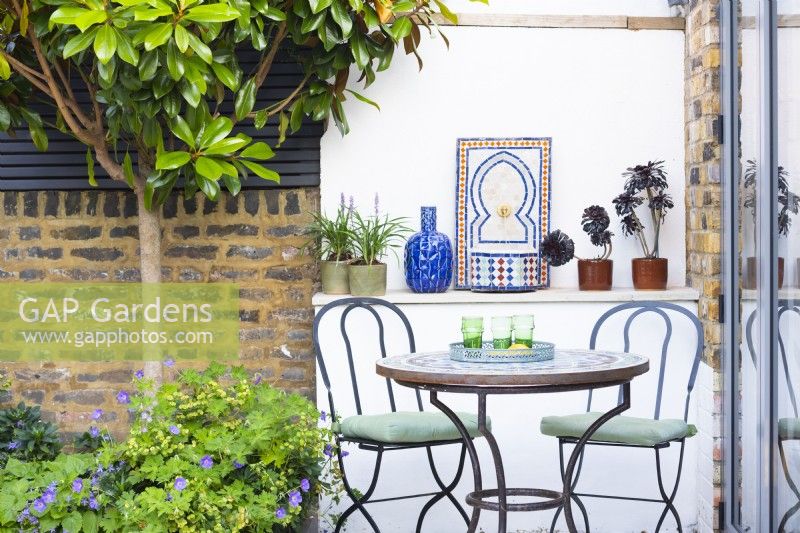 Mediterranean corner with table and chairs. 