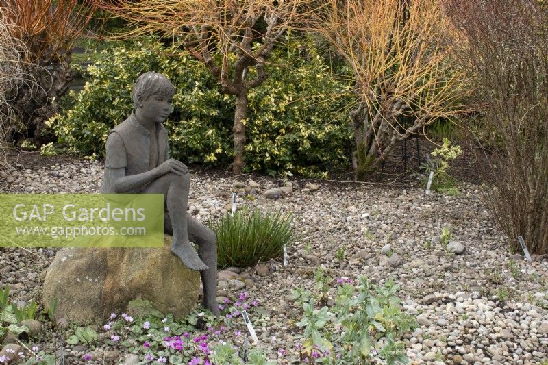 'Boy on a Rock' by Jane Hogben  in John's Garden at Ashwood Nurseries - Kingswinford - Spring