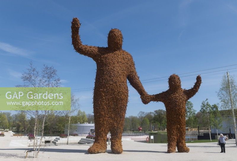 Almere The Netherlands 19th April 2022
Floriade Expo 2022. A ten-yearly botanical garden festival and exhibition, this year taking place in Almere, Flevoland. 
Statue Beehold by Arnhemse artist Florentijn Hofman, two figures holding hands and waving made up of hundreds of bees. 