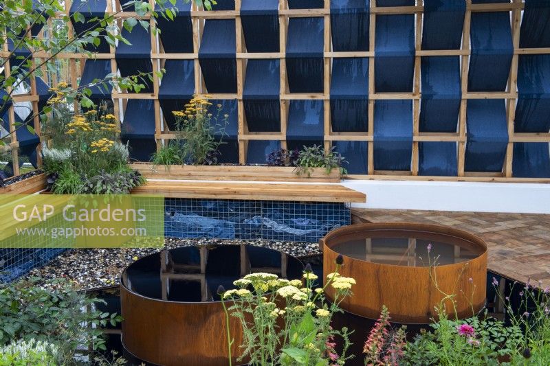 Corten steel water pools in The Fashion Footprint Garden, RHS Hampton Court Palace Garden Festival 2021