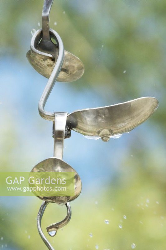 Rain watering system made of old spoons.