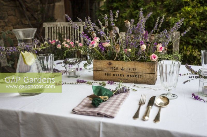 Set garden table with lavender, flowers and candles - Lavender summer party story