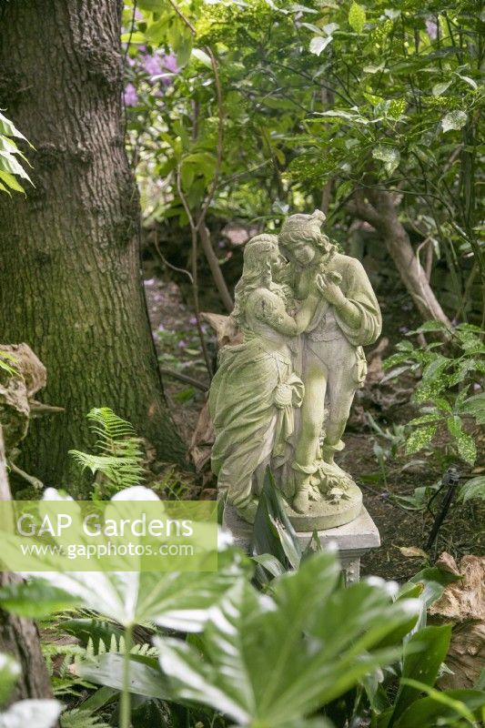 Sculpture of lovers at Hamilton House garden in May 