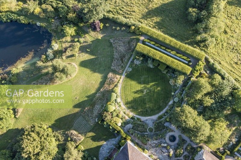 Aerial view of Forest Lodge garden in July with circular lawn, hornbeam allee and terraces