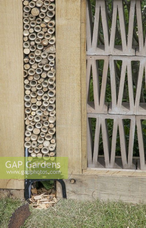 Hedgehog home and insect hotel in The Wooden Spoon Garden at RHS Hampton Court Palace Garden Festival 2022