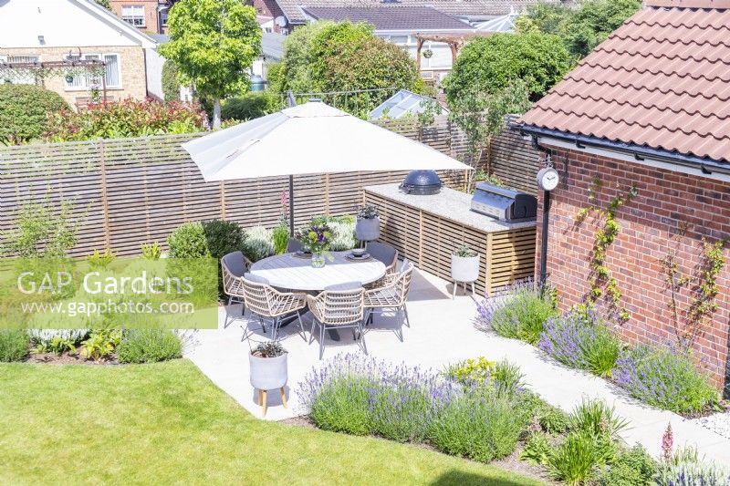 Overview of shaded seating area and outdoor kitchen