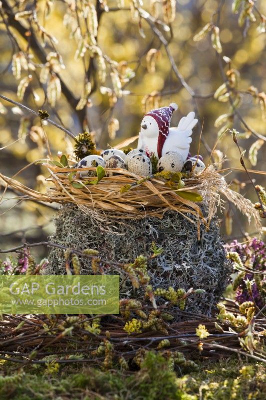 Easter decoration with quails eggs in nest.