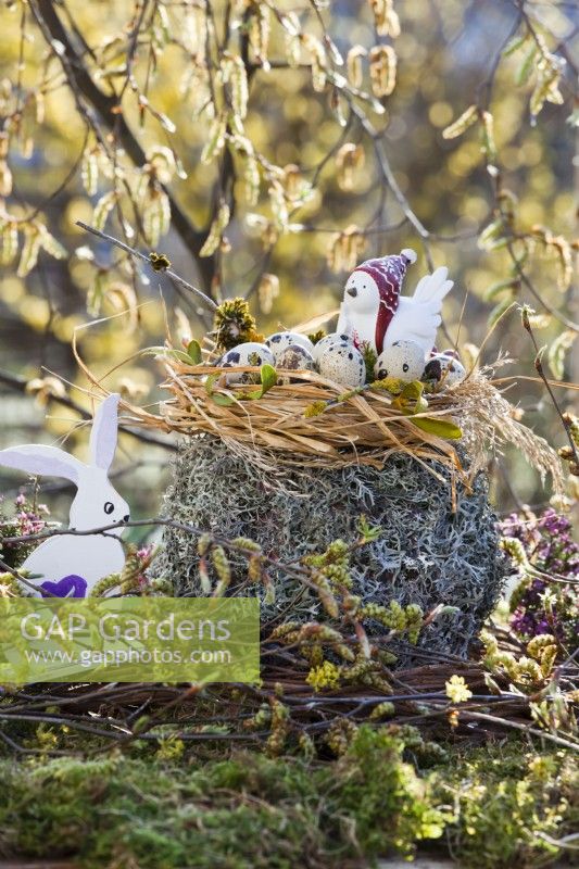 Easter decoration with quails eggs in nest.