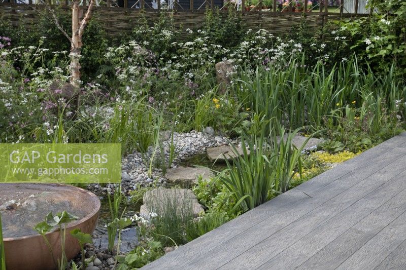 The water feature and planting in The Hide Garden at RHS Malvern Spring Festival 2022