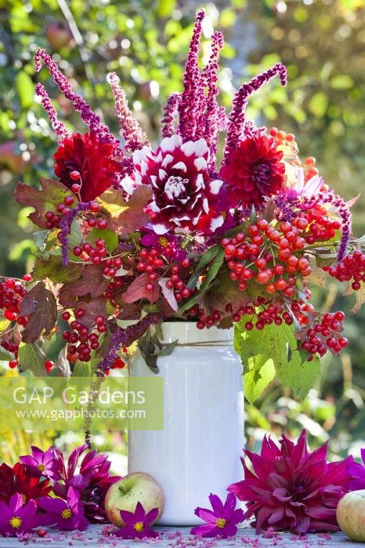 Red themed bouquet containing Dahlia, Guelder rose branches with berries and Love Lies Bleeding.