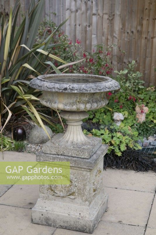 Stone bird bath in a garden setting 