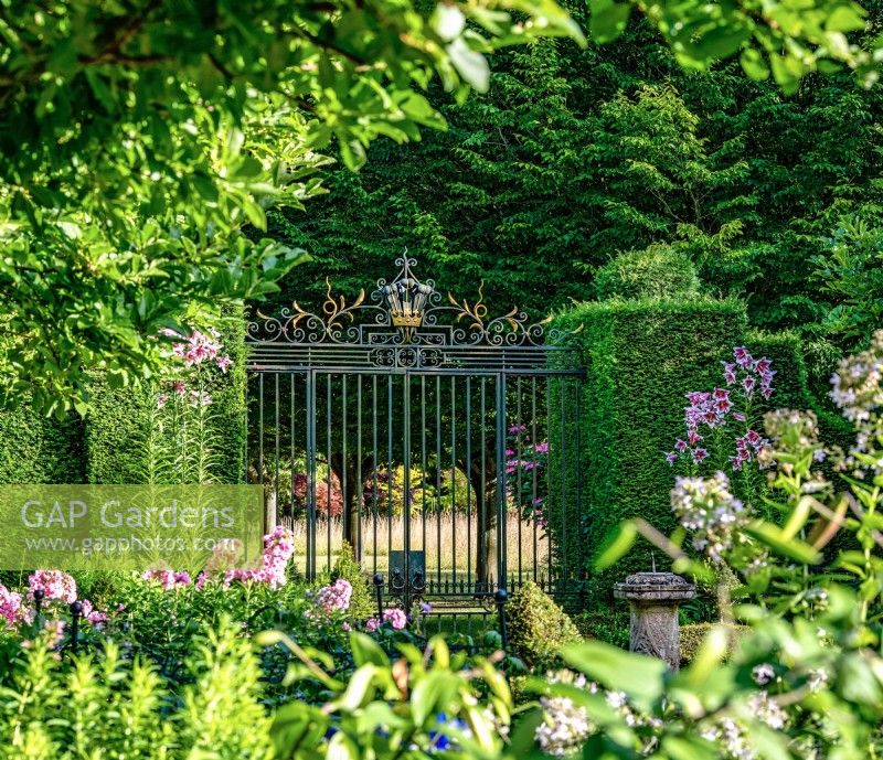 The reclaimed gates in the Sundial Garden was found and adapted for Highgrove, July, 2022.