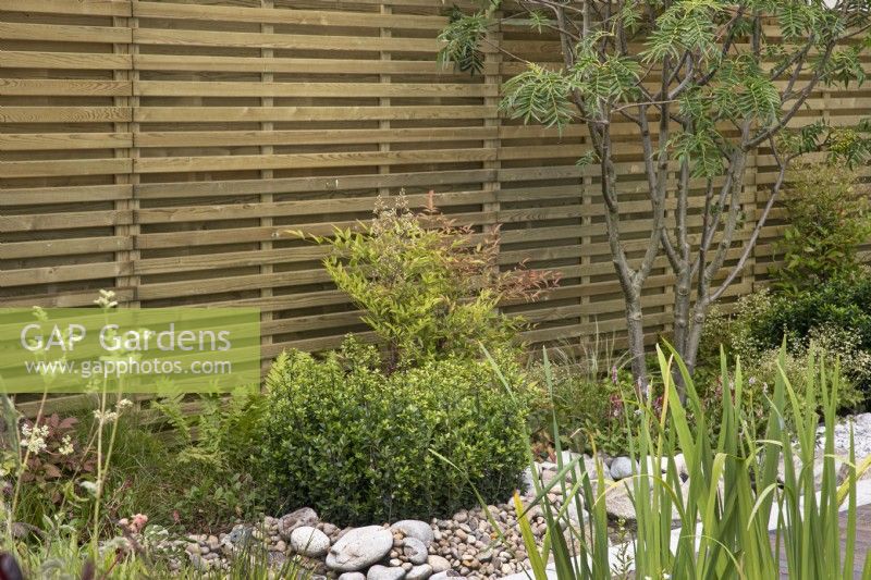 Wooden screen in The Memories of Mountains Garden Retreat Garden at BBC Gardeners World Live 2022