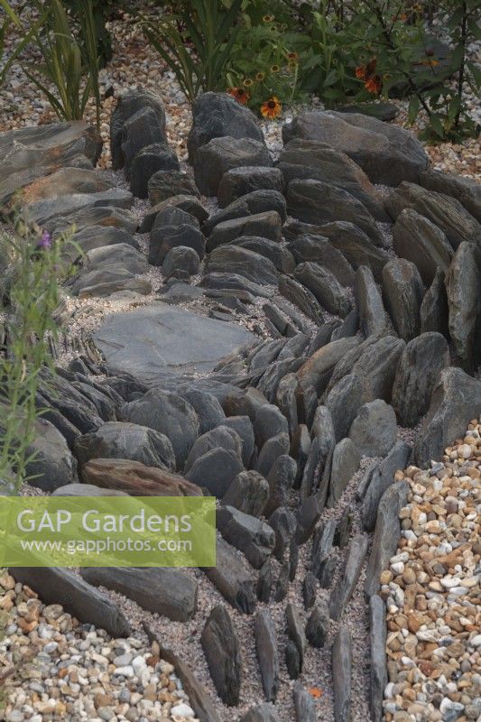 Decorative slate feature in gravel garden