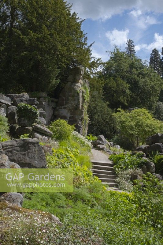 Stone steps leading up to the cascade over Wellington Rock in Paxton's Rock Garden at Chatsworth House and Garden.