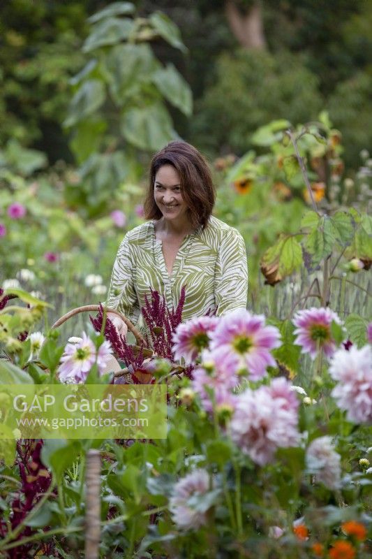 Susie Harris-Leblond picking flowers in her cutting garden