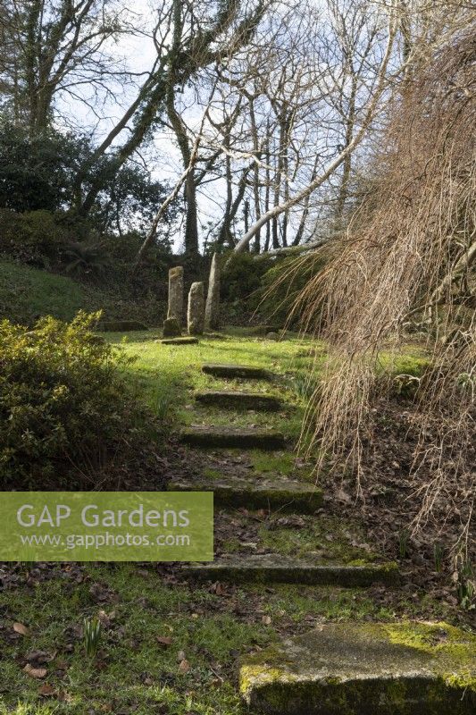 Steps lead up to the Magic Circle, a stone circle at The Garden House, Yelverton, Devon
