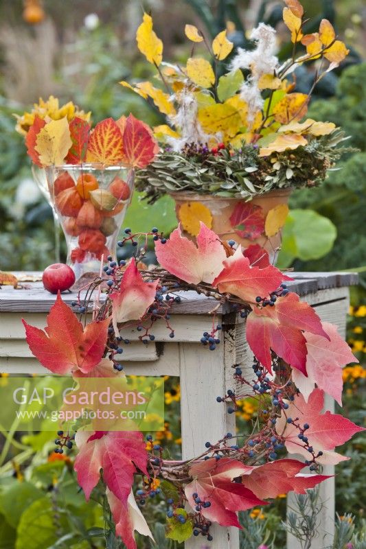 Autumnal arrangement with leaf wreath made from Boston ivy.
