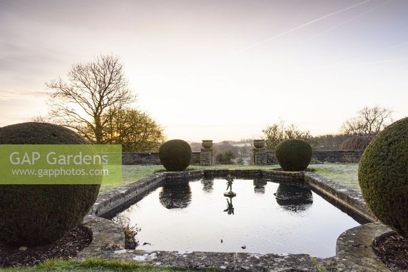 Formal lily pond on the Jewson Terrace at Cotswold Farm Gardens in February