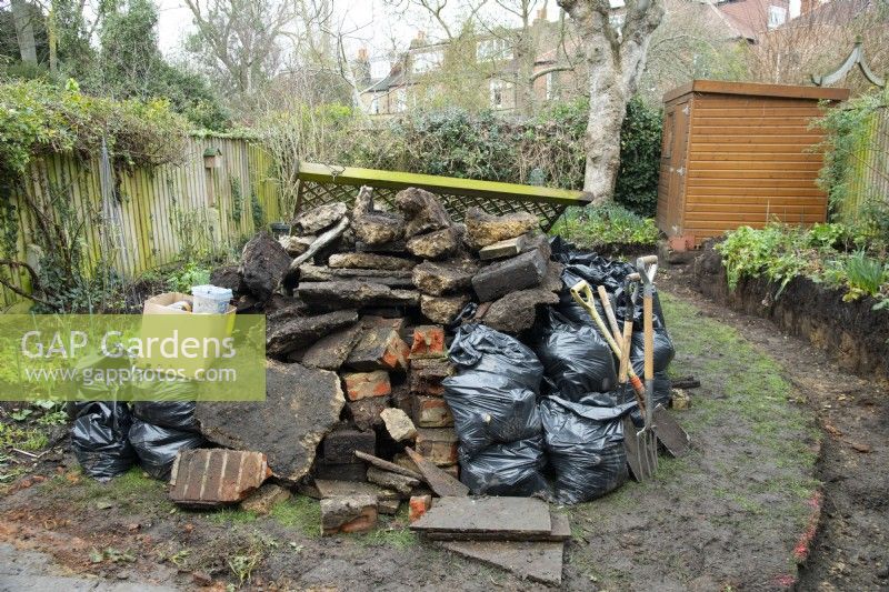 A pile of rubble at the beginning of the makeover of a small London garden.