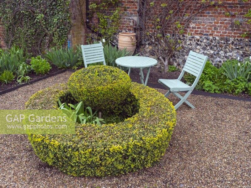Circular box hedge and Topiary with seating area