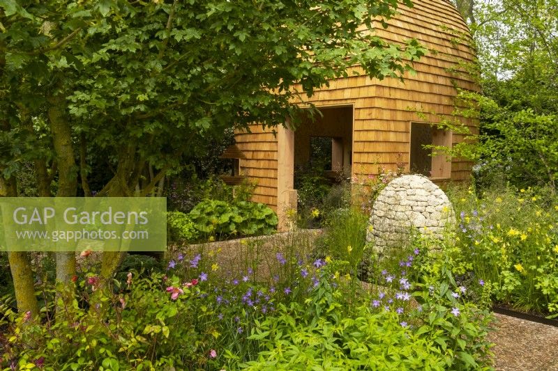 Horatio's Garden, a show garden designed by Charlotte Harris and Hugo Bugg featuring a woodland retreat, herbaceous planting  and accessible areas for people affected by spinal injuries.  