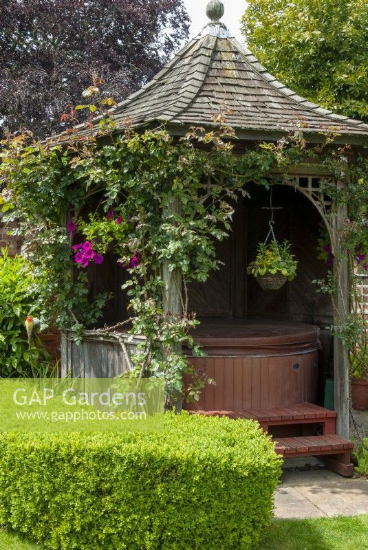 Gazebo with steps leading into hot tub housed inside - Open Gardens Day, Bures, Suffolk