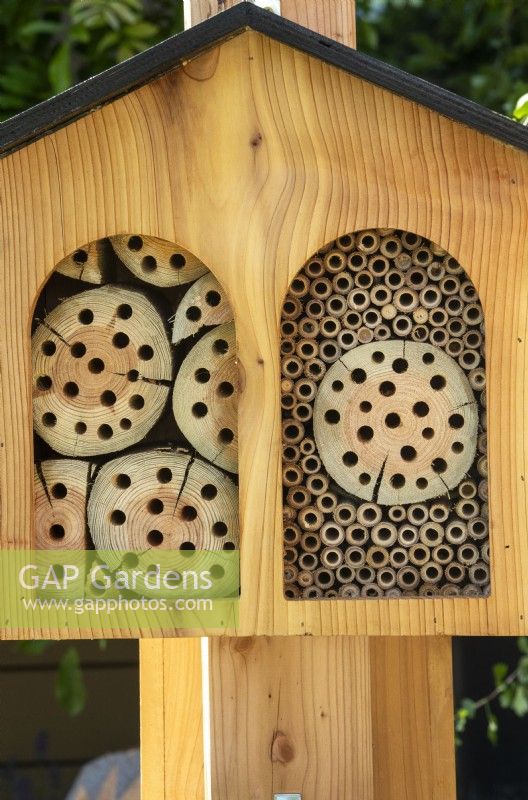 Wooden garden bug box mounted on a post - The Chic Garden Getaway - BBC Gardeners' World Live 2023 - Designer: Katerina Kantalis