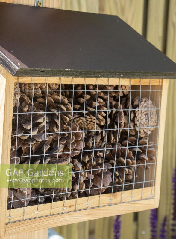 Garden bug boxes filled with pine cones - The Chic Garden Getaway - BBC Gardeners' World Live 2023 - Designer: Katerina Kantalis