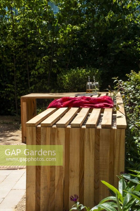 Wooden L-shaped slatted wood bench - The Beauty in Small Spaces - BBC Gardeners' World Live 2023 - Designers TJ Kennedy and Kerianne Fitzpatrick
