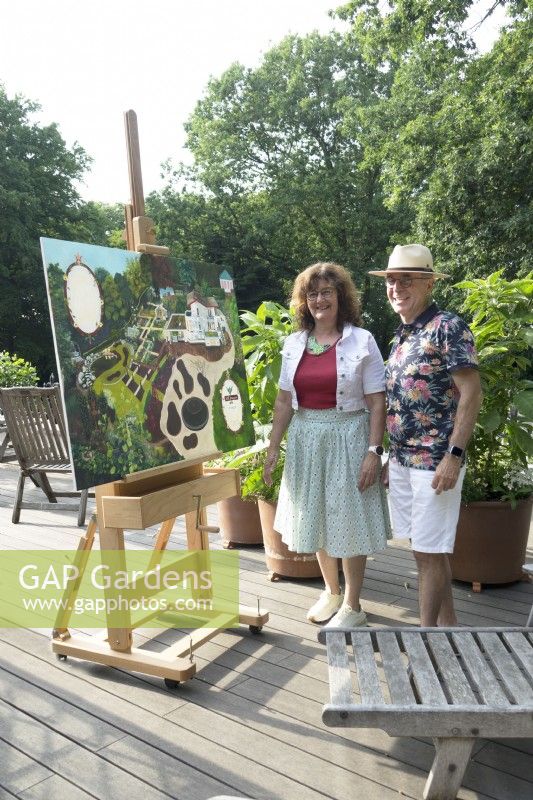 Owners Villa Sprezzatura showing the not yet finished oil painting of their garden on the roof terrace.
