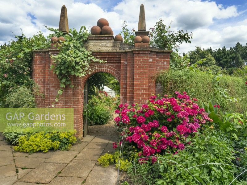 Entrance arch to the Mediterranean Garden East Ruston Old Vicarage Gardens Summer July