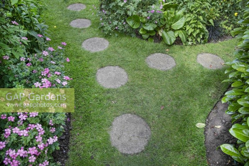 Stepping stones in the grass in Garden open for Charity, Four Oaks, June
