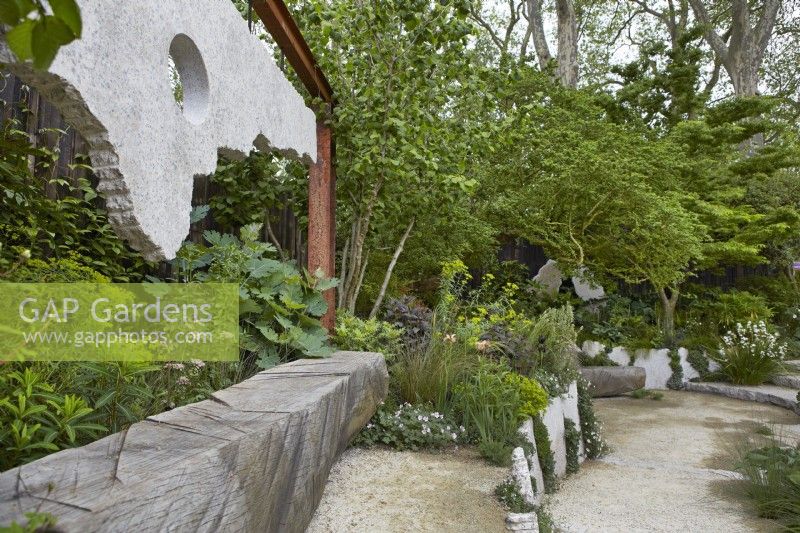 The Samaritans Listening Garden. Designer: Darren Hawkes. Chelsea Flower Show 2023. A garden of salvaged materials and suspended concrete panels. Summer. May.