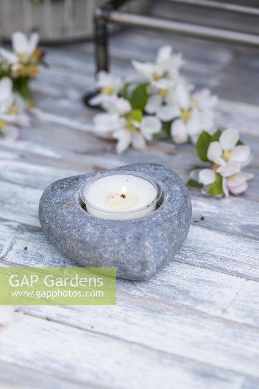 Tealight in small stone tealight holder with blossom