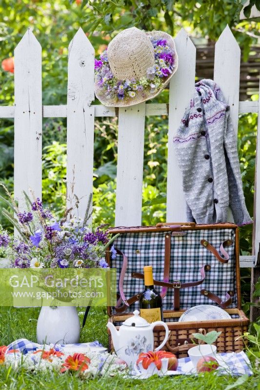 Set for picnic with floral arrangements.