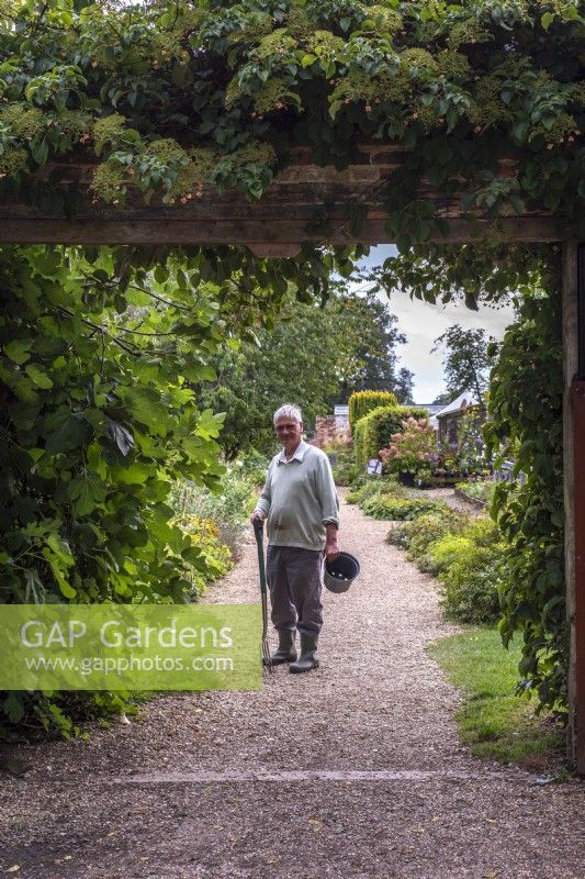 Owner of West Acre Gardens at the entrance 