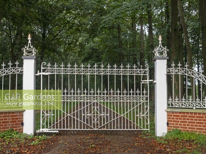 View through  ornate metal white gates